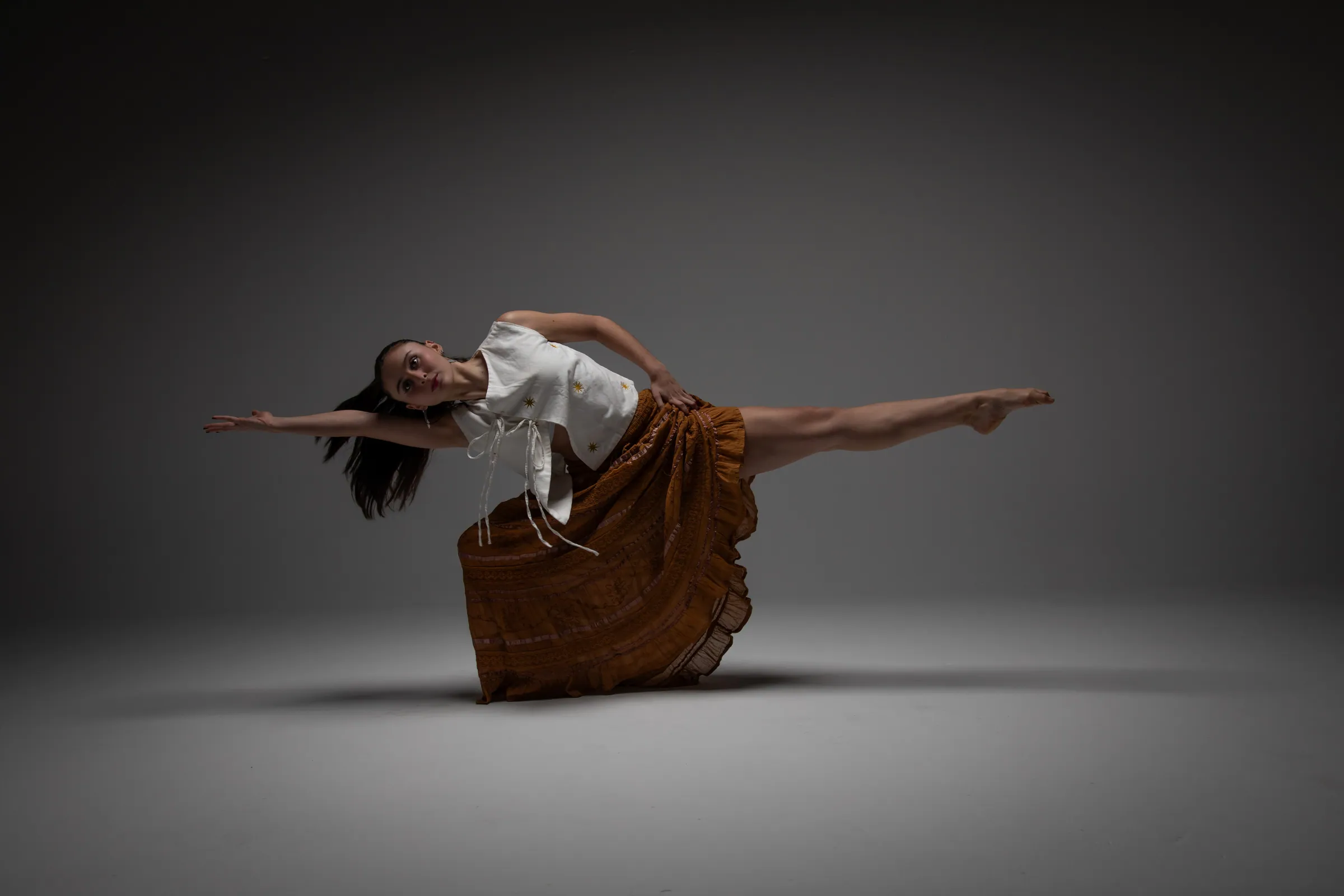 Estefania Forero Yacaman extending horizontally through a grounded balance